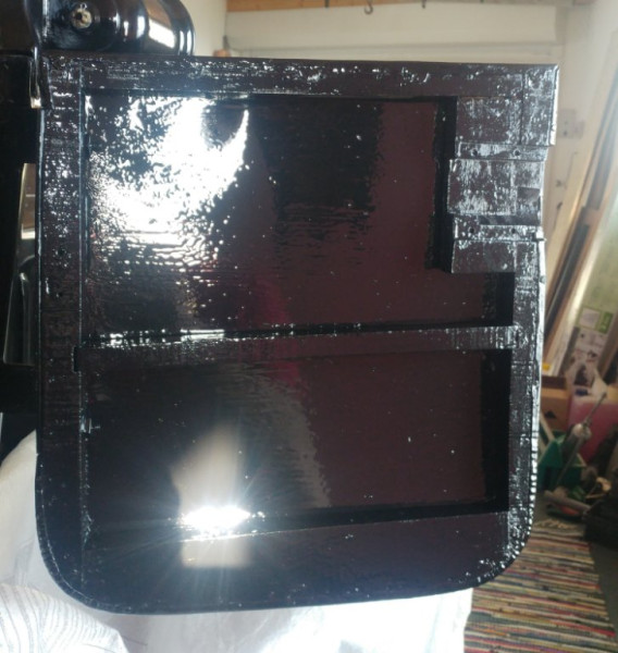 Door after re-painting.   The dent on upper border  was filled from outside by former owners before painting.
