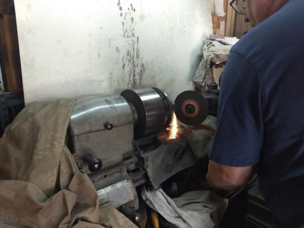 Tool post grinder working on the output shaft.
