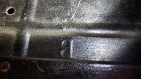 Beudette stamp in face of seat riser