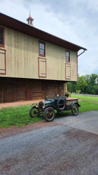 My T in front of a barn that was moved from Millersburg PA and faithfully restored.
