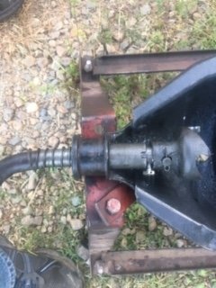 Bolt inserted proud on side opposite the hand crank handle
