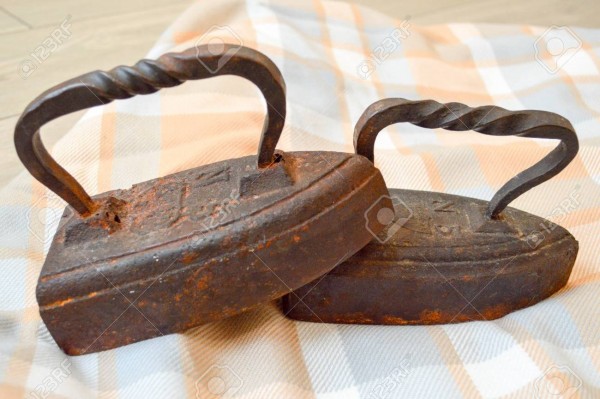 90961680-two-very-old-cast-iron-on-charcoal-antique-irons-.jpg