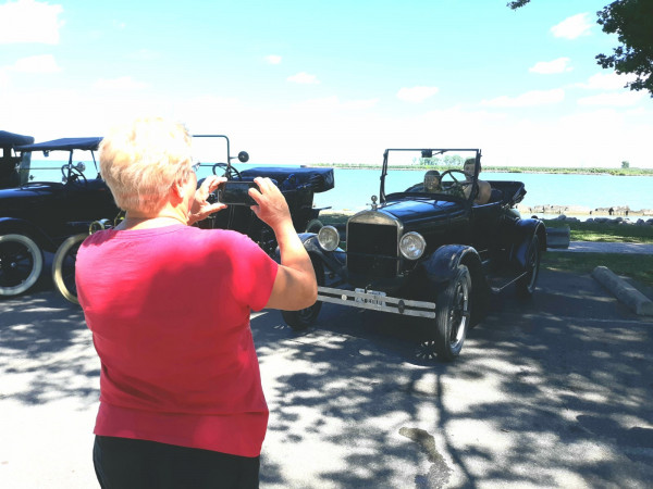 As always, the cars drew attention. Young lad in Jim's '26 Runabout.