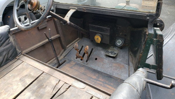 Relatively original body, interior appolstery appears to have been replaced at some point. Notice the body tags tacked to seat frame.