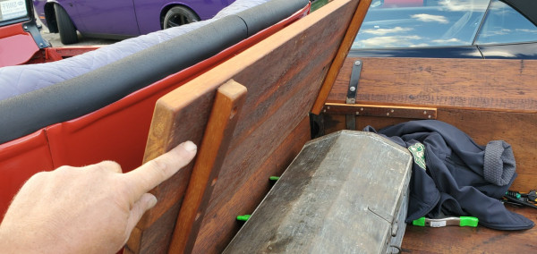Rear bench seat hinges up for larger items in the bed.
