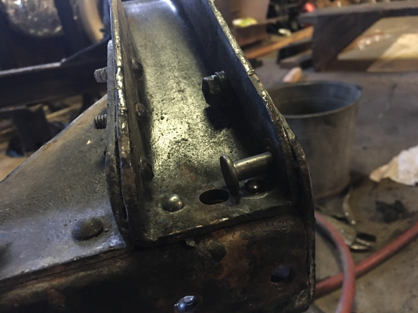 Installing rivets on front crossmember
