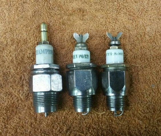 Three early Champion related plugs.jpg